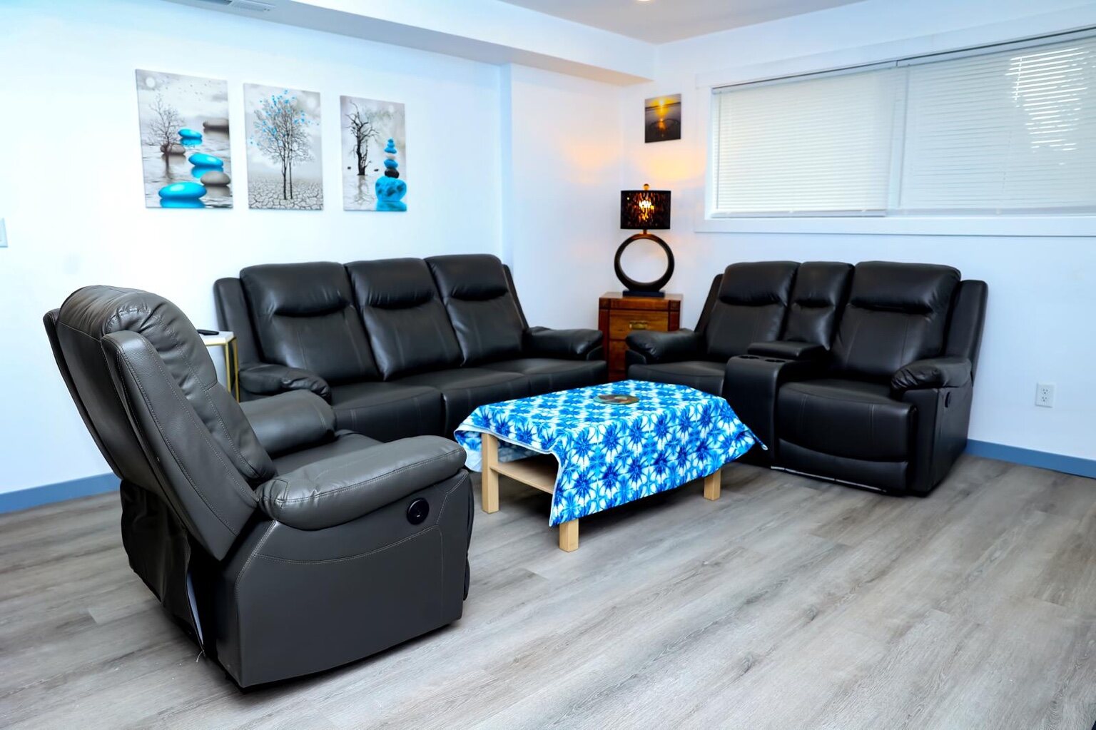 Bright shared living room with comfortable reclining chairs